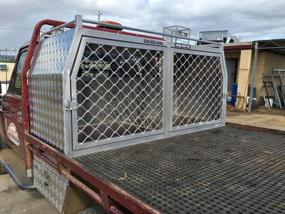 Custom made aluminium dog cage fabricated by Dunn Metal Works fitted to a ute tray